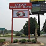 Tall commercial pylon sign for auto shop business