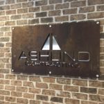 Metal sign routed to show the Ashlind Contracting logo